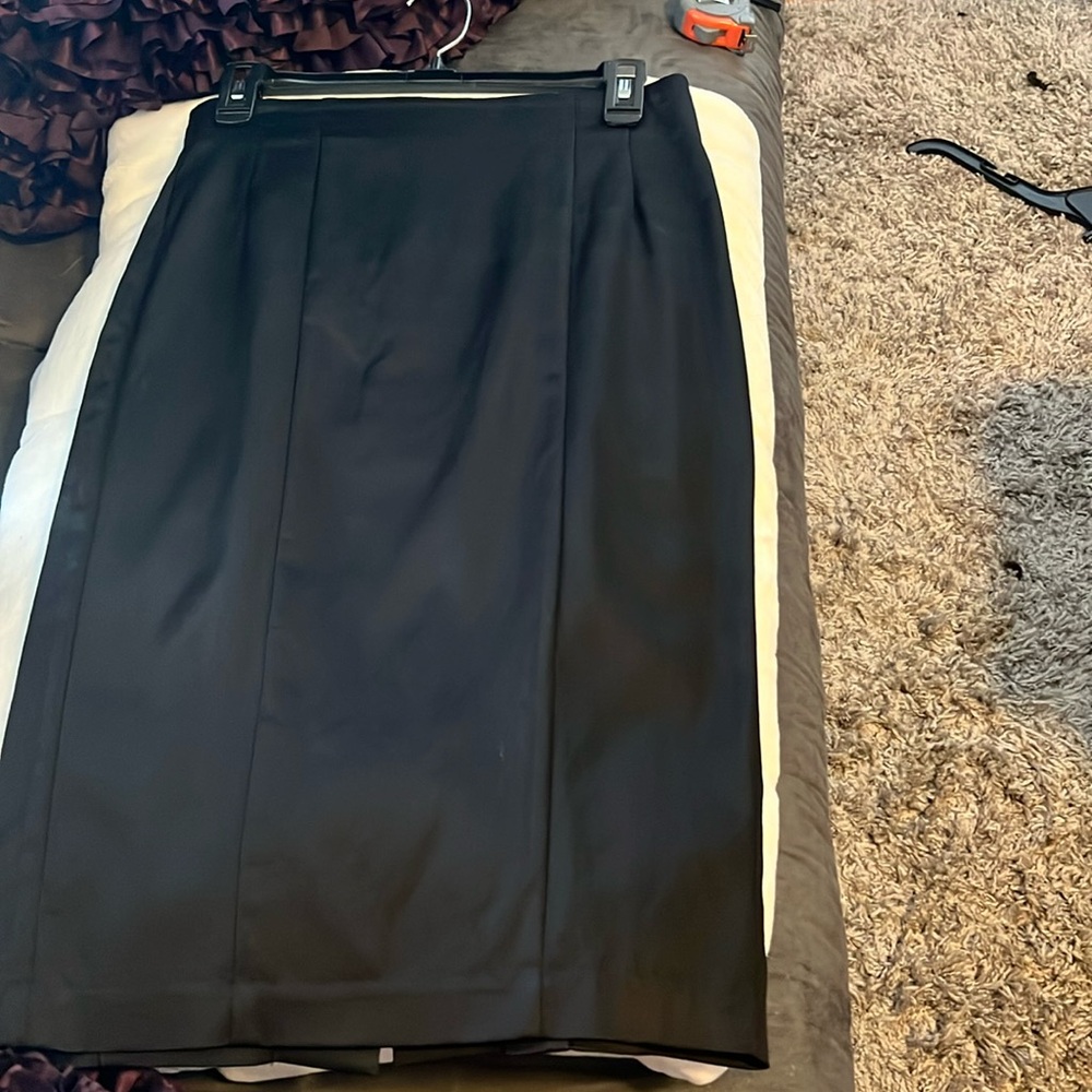 Bebe satin black pencil skirt. Sz 6. Zip back w/5 buttons bottom slit in back.